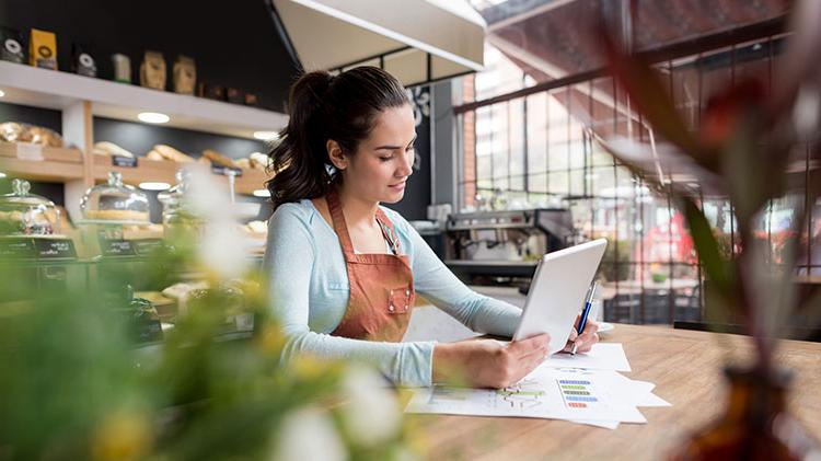 Woman reviewing business plan for small business.